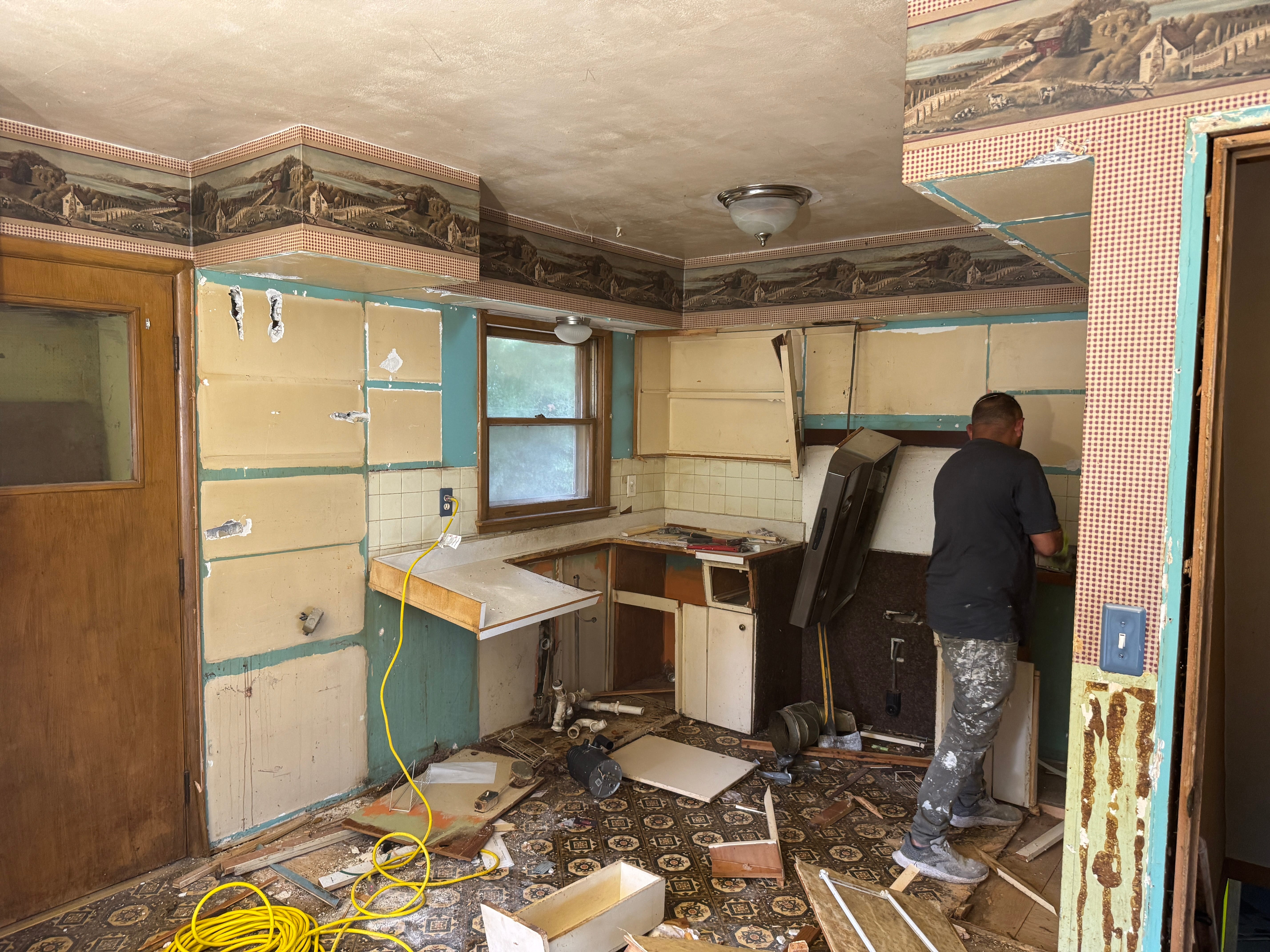 Interior demolition gut job action shot in Milwaukee