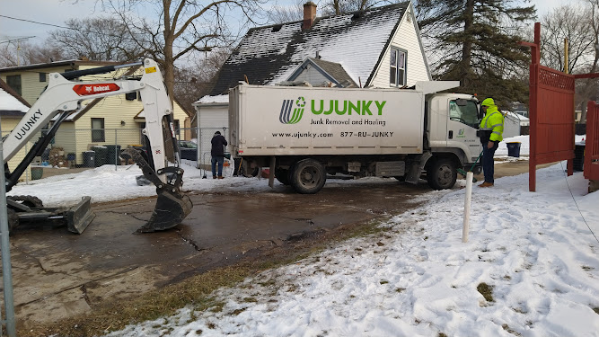 a machine putting debris on a truck